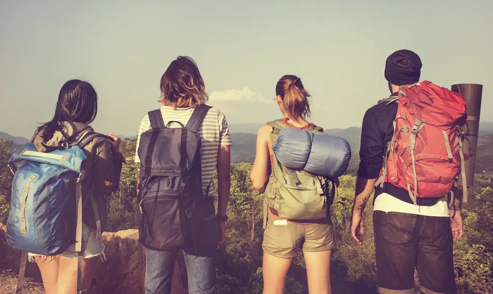 Image of backpacking young adults in the mountains