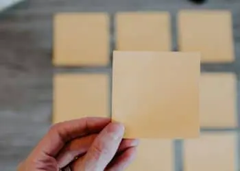person holding white printer paper