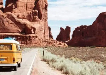 yellow Volkswagen van on road